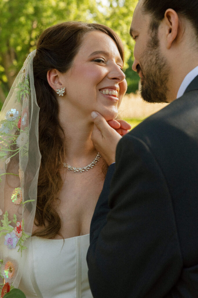 Tender moment between bride and groom captured in documentary style